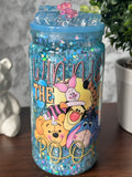 Image 1 (front): "Dreamy Blue Glitter Tumbler — 16 oz snowglobe tumbler with blue glitter finish and Winnie the Pooh sticker (uv dtf) design, handcrafted at Motiva Ink Studio"

